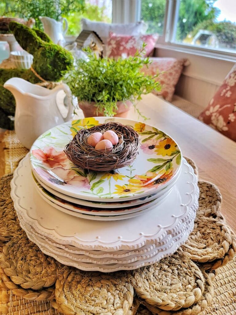 flower dishes with nest and eggs Easter vignette tabletop ideas