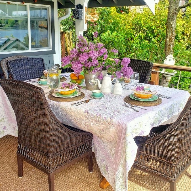 An outdoor May spring tablescape with lilacs
