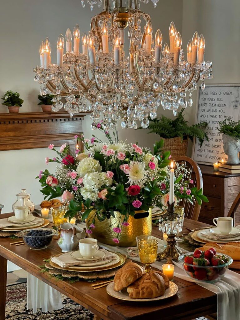 dining room with flower arrangement and chandelier