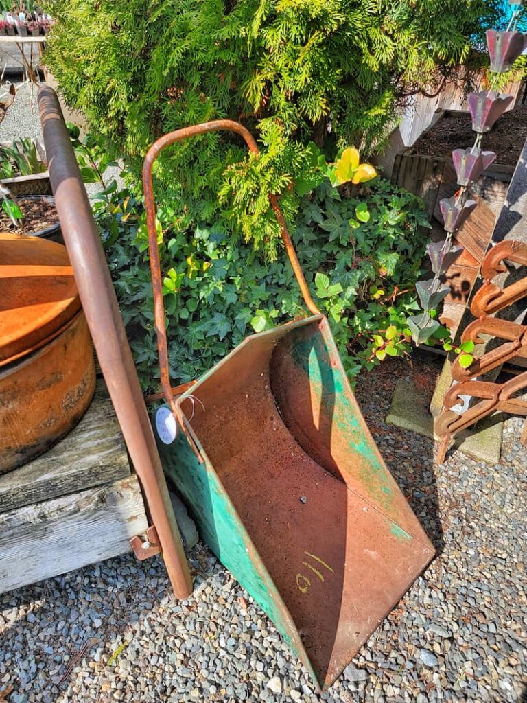 vintage rust and green wheelbarrow