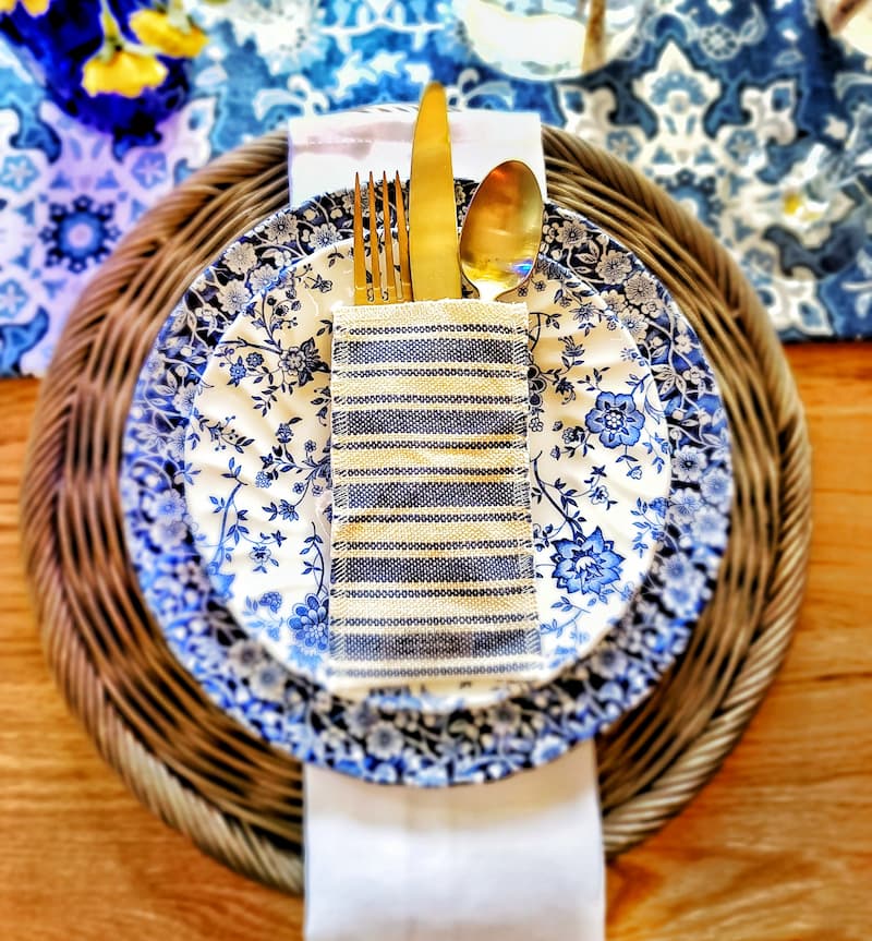blue and white dishes and silverware pouch