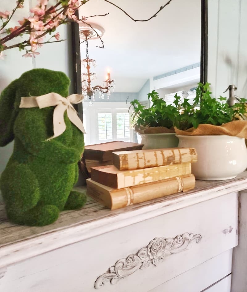 moss bunny and vintage books on mantel Easter vignette tabletop ideas