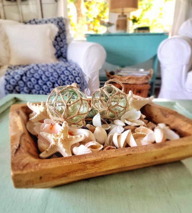 seashells in wooden bowl for summer decor