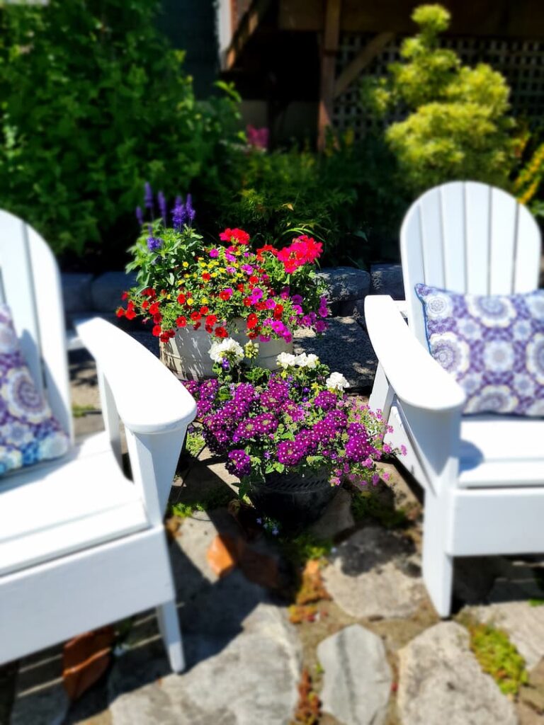 summer flower containers and Adirondacks chairs