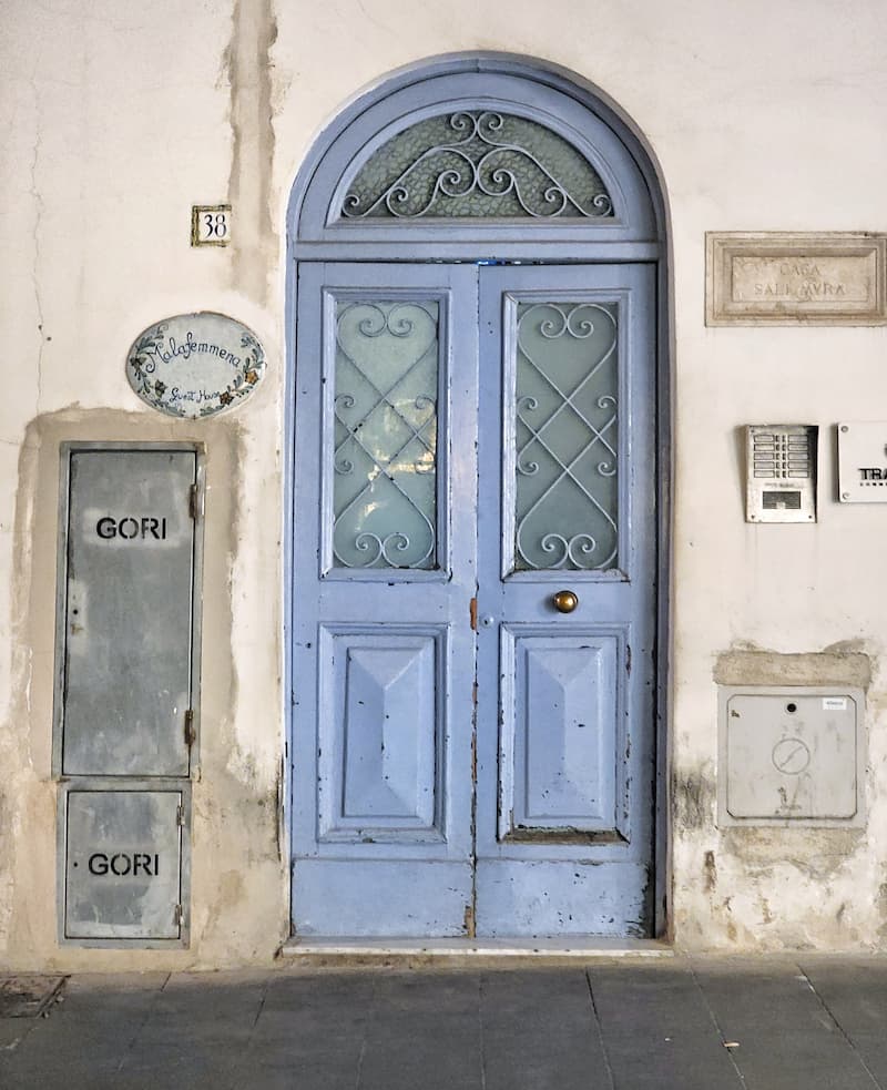 periwinkle vintage door with glass and iron