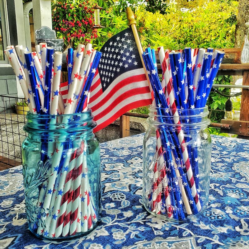 patriotic straws and flag in glass jars