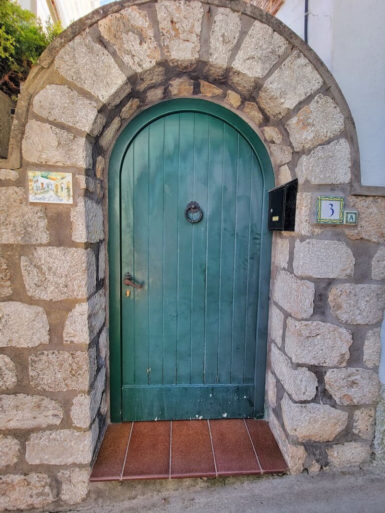 green vintage arched door