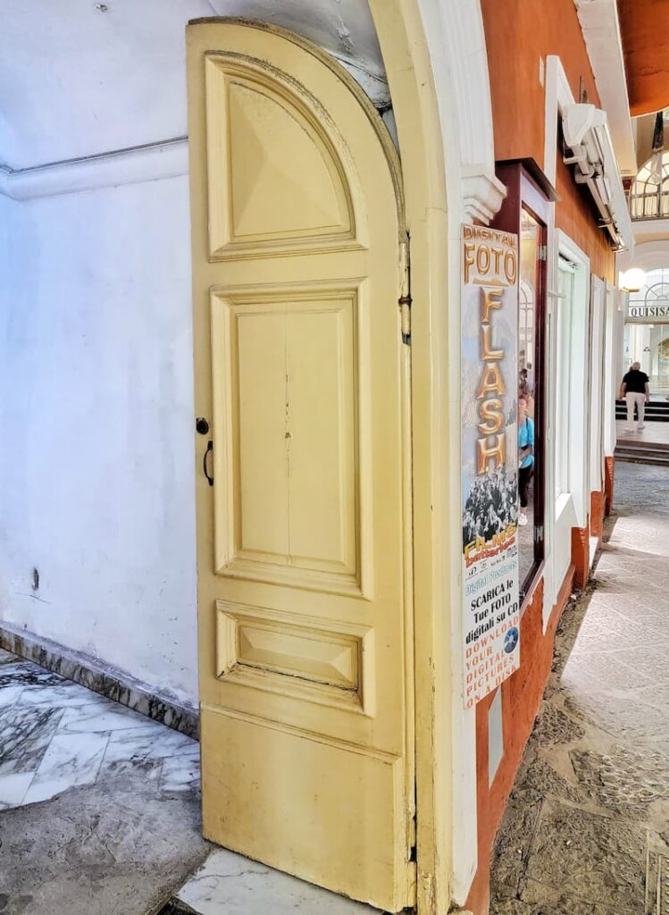 European yellow vintage arched wooden door