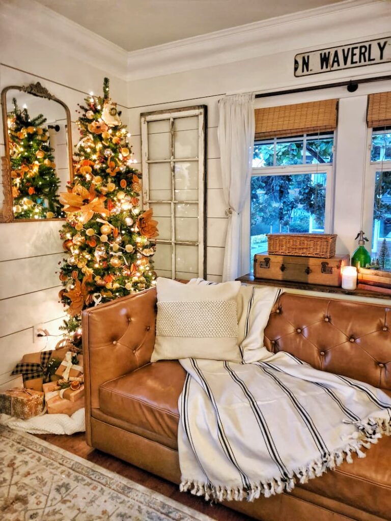 planning ahead for Christmas decor - 
leather couch and Christmas tree