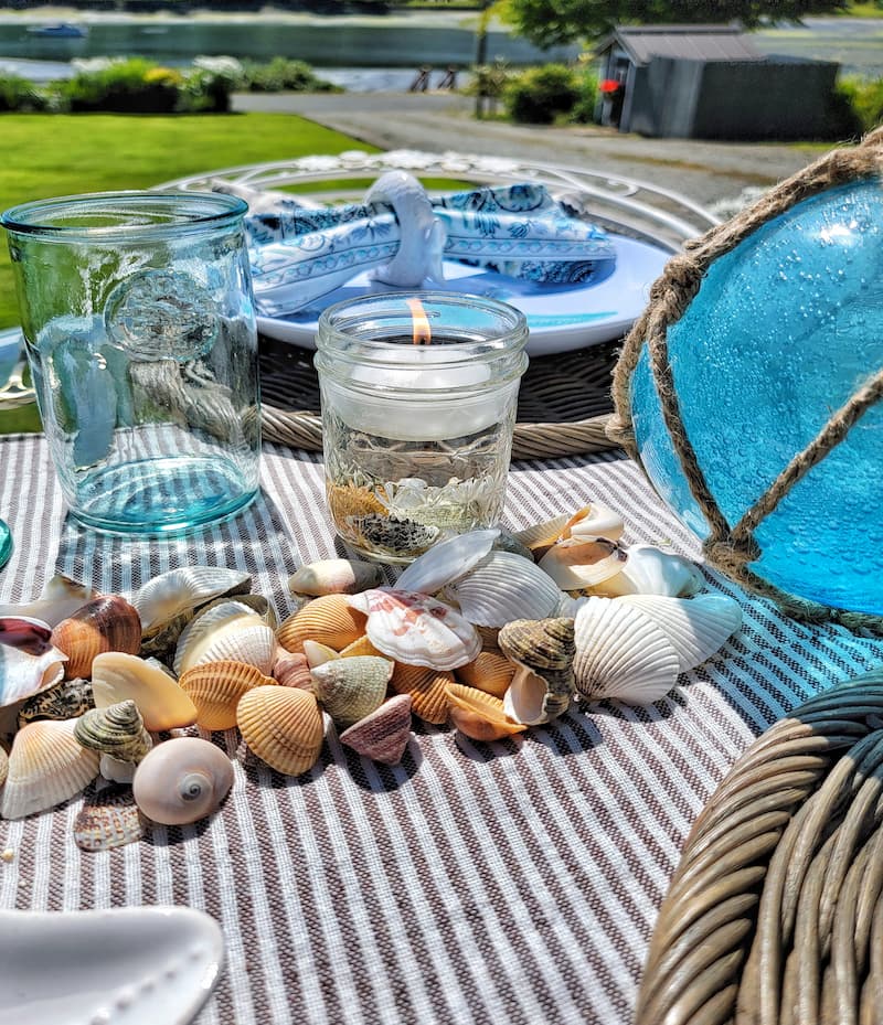 coastal themed table with shell centerpiece