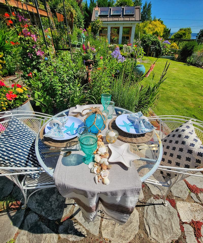 summer coastal tablescape overlooking the cottage garden