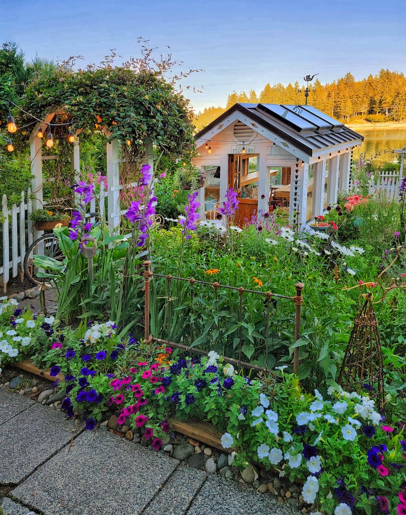 summer cottage and cut flower garden - greenhouse view