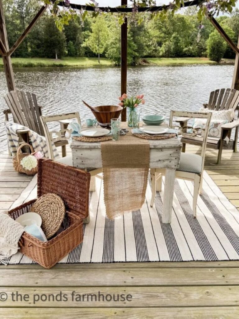 table on dock with pond