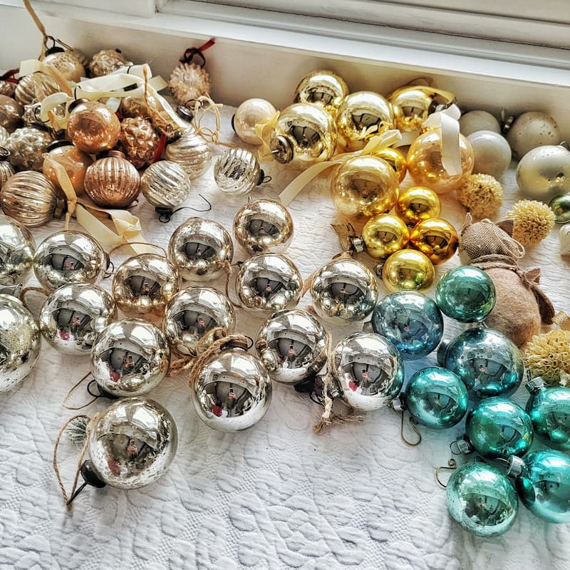 planning ahead for Christmas decor - 
silver, gold, and turquoise Christmas ball ornaments