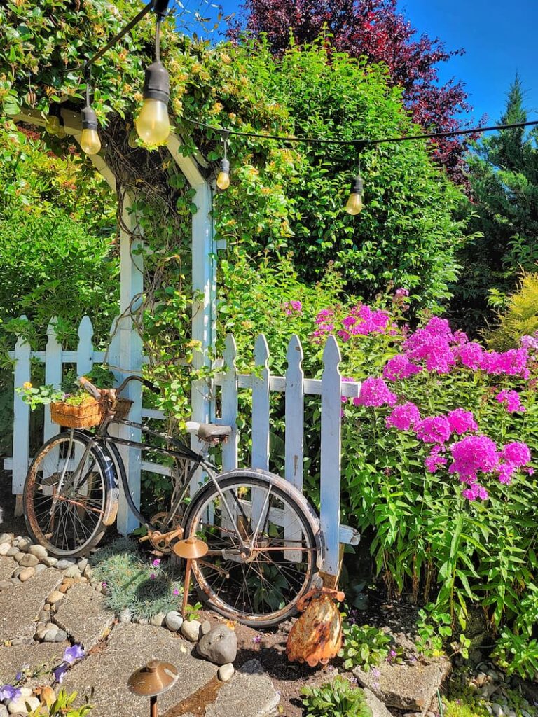 white picket fences and vintage bike