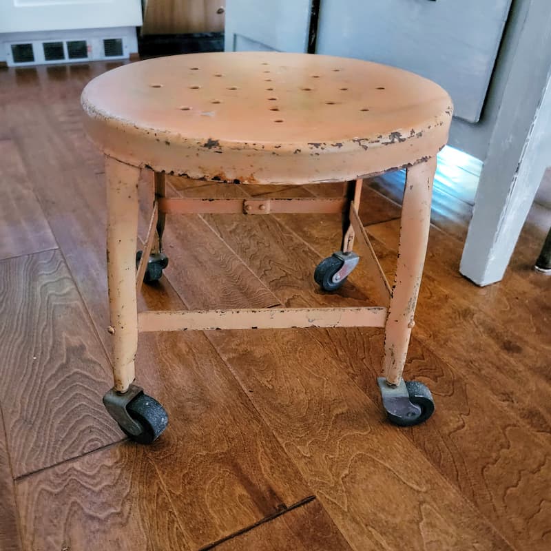 orange vintage stool with rollers