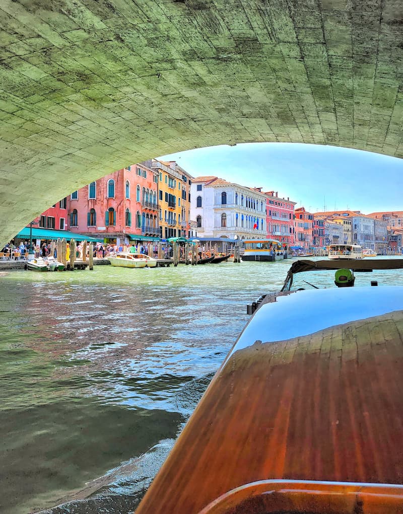 boat going under a bridge in Venice, Italy