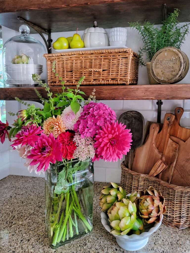 open shelves and flowers in fall kitchen