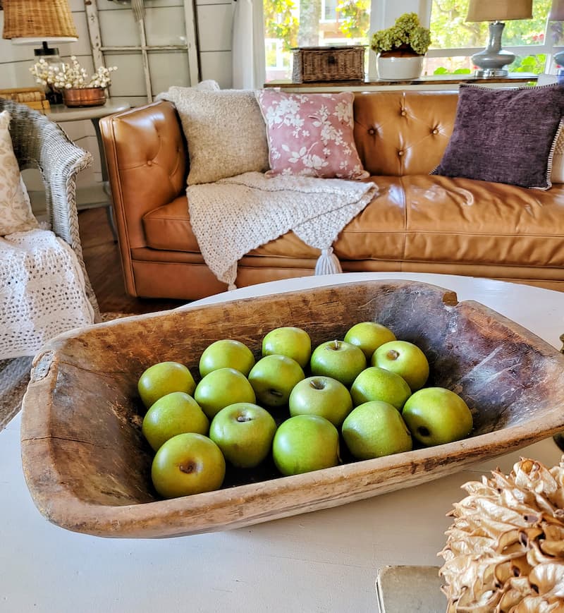 faux green apples in vintage wooden dough bowl fall home decor ideas