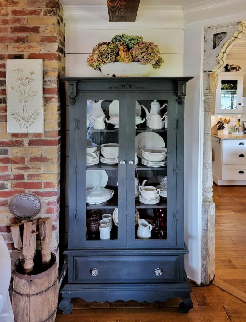 black cabinet with white ironstone