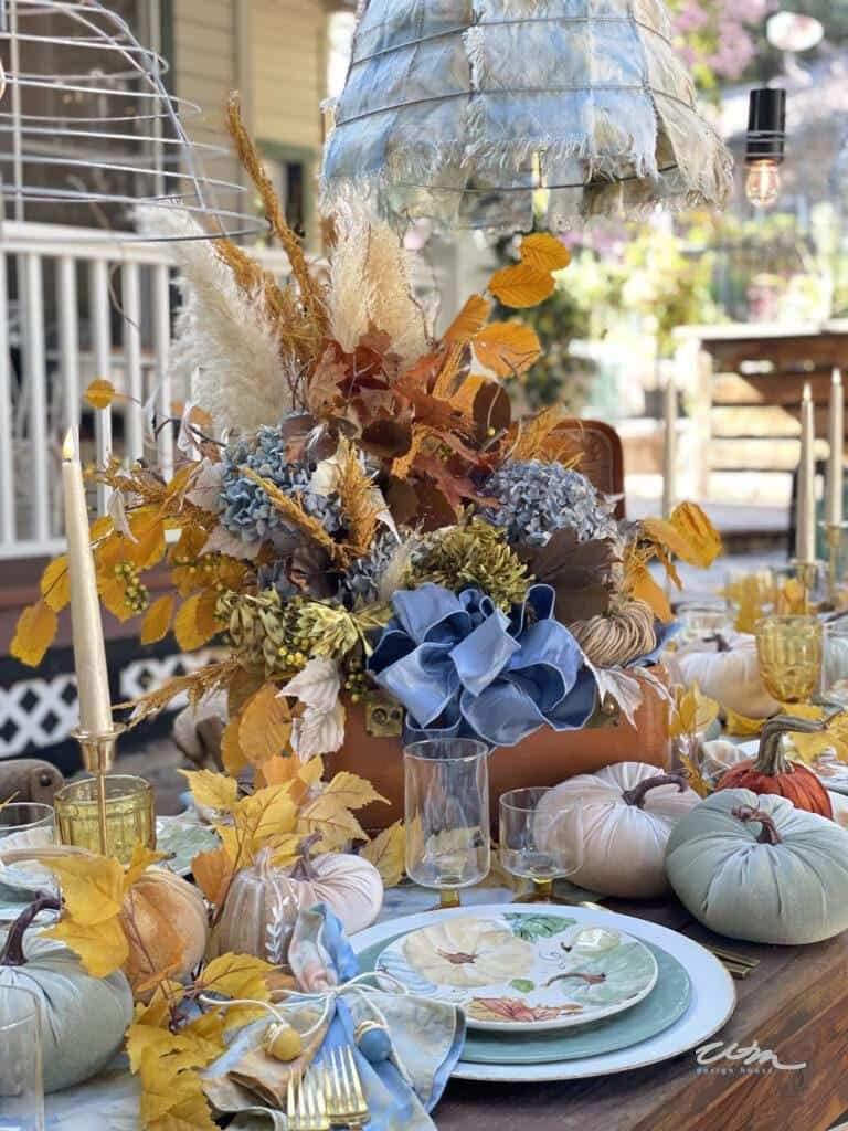 velvet pumpkins and fall decorations on table