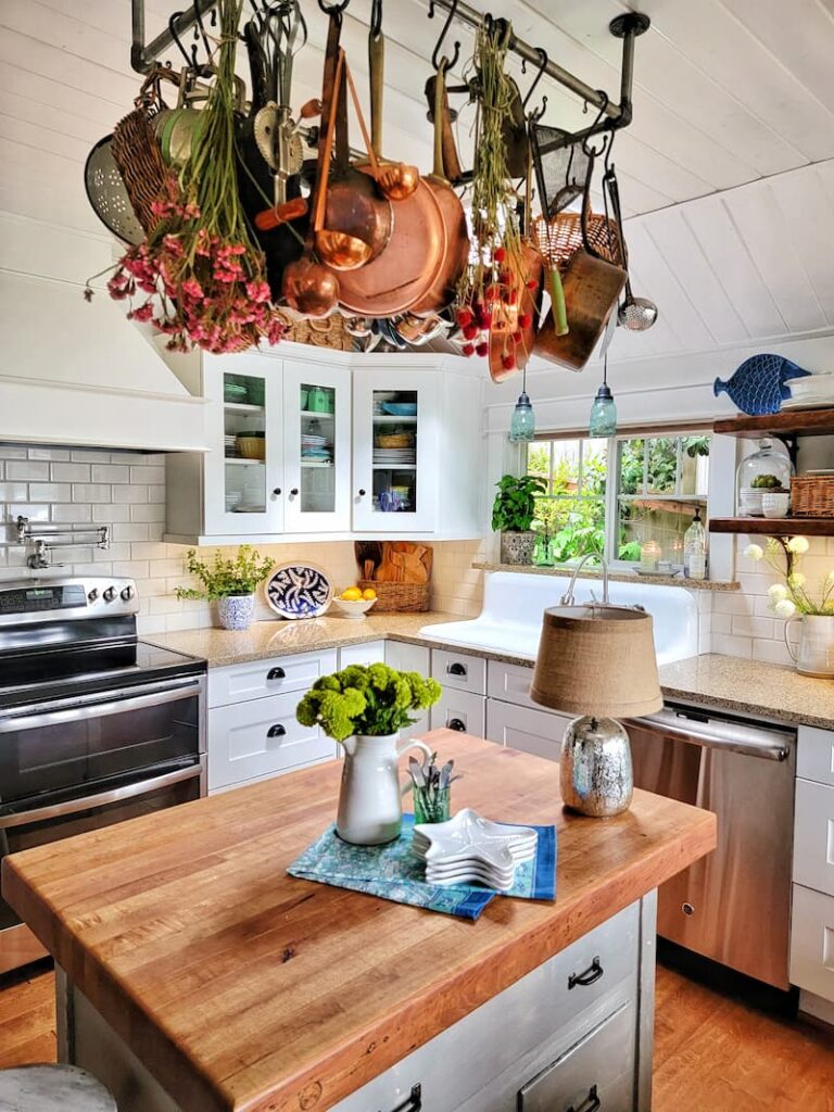 cottage style kitchen with island and pot rack