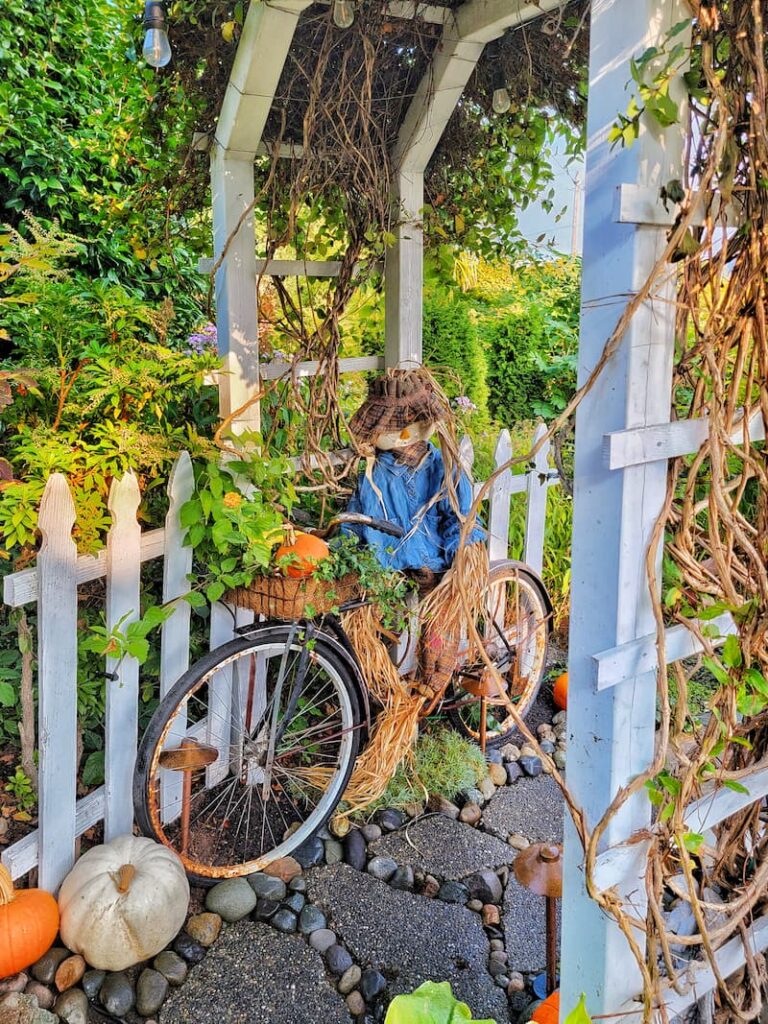 greenhouse fall decorating ideas scarecrow on vintage bike