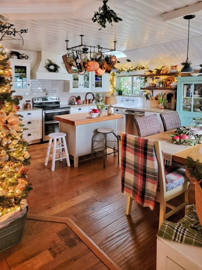 cottage kitchen with Christmas tree and plaid blanket