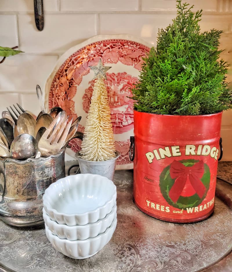 Cottage Christmas decor ideas: red pine ridge canister with faux tree inside and silver accessories