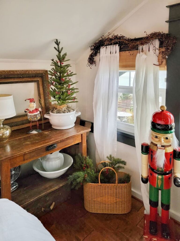 antique end table and nutcracker