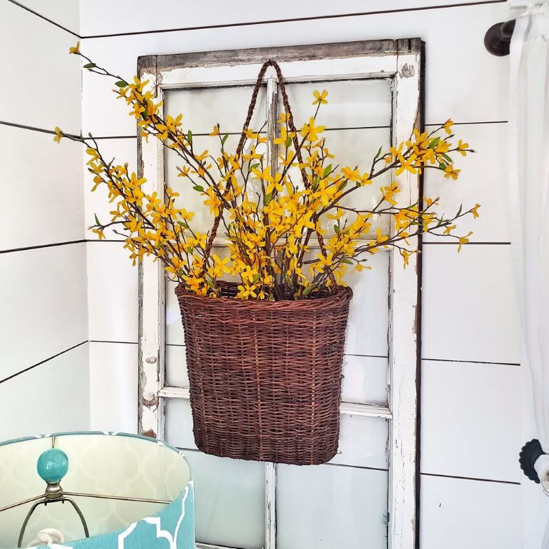 Create a  Bright and Warm Winter Space by Adding Flowers and Greenery: faux forsythia in basket