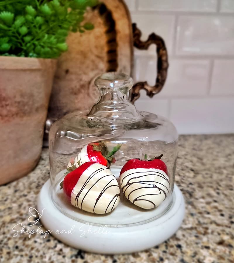Valentine's Day decor ideas: white chocolate covered strawberries in glass cloche