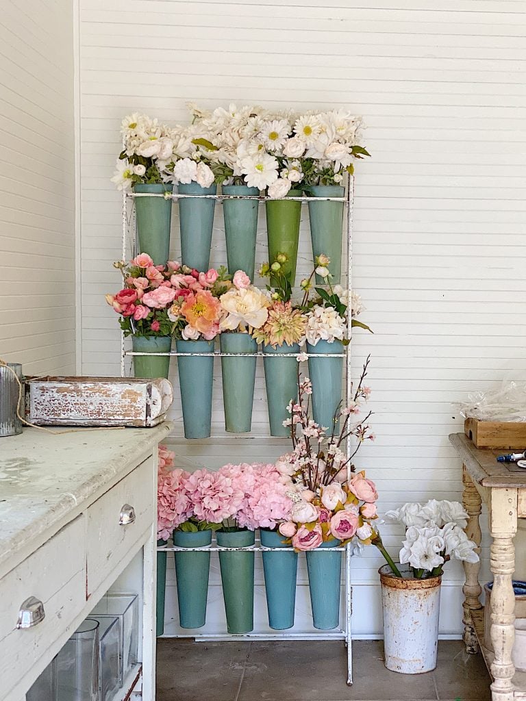vintage flower stand with faux flowers