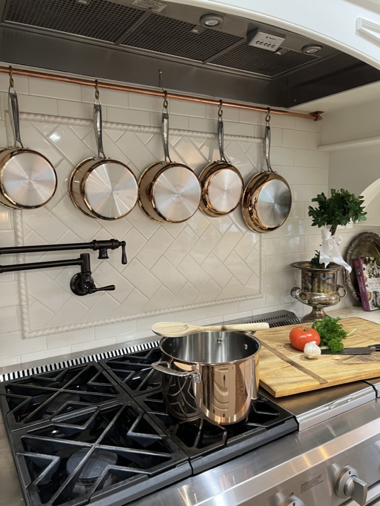 copper pot rack in kitchen