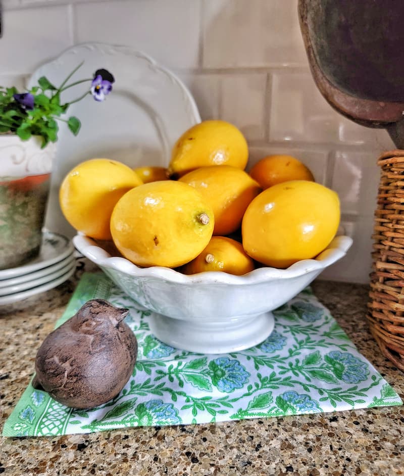spring thrift store finds: lemons in a vintage white ironstone scalloped dish