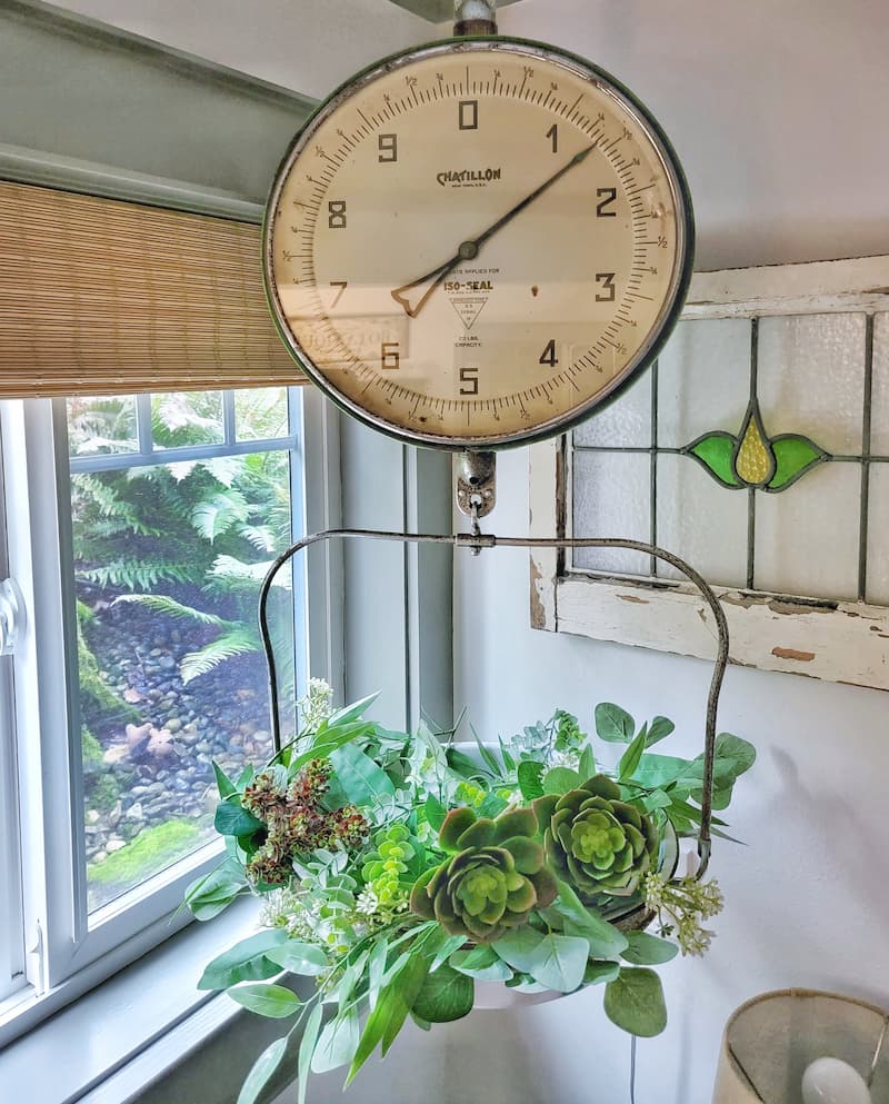 spring thrift store finds: hanging vintage scale with greenery