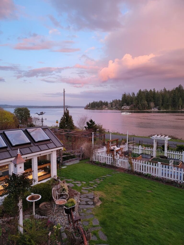 sunset view of the bay and cottage garden