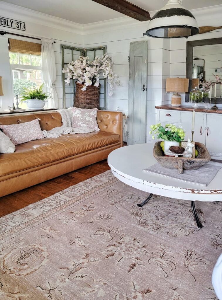vintage pink and cream patterned rug in living room