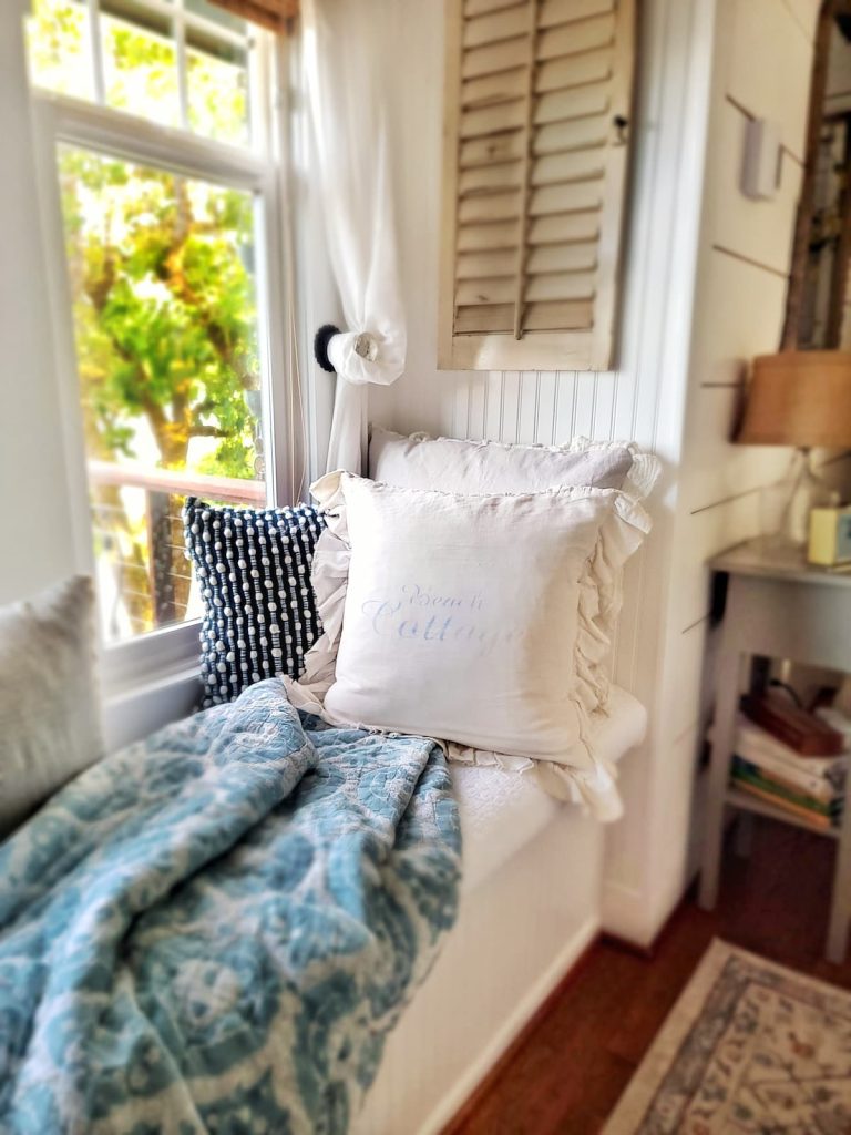 pillows and throws on window seat