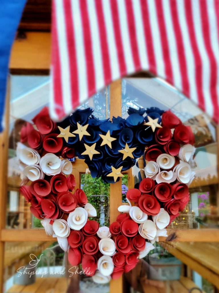 red, white , and blue wreath shaped in a heart