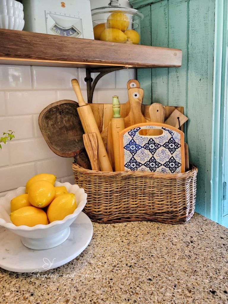 basket with vintage wooden rolling pins and breadboards