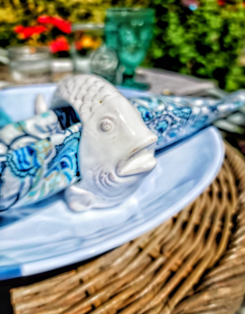 ceramic fish napkin ring and blue and white print napkin