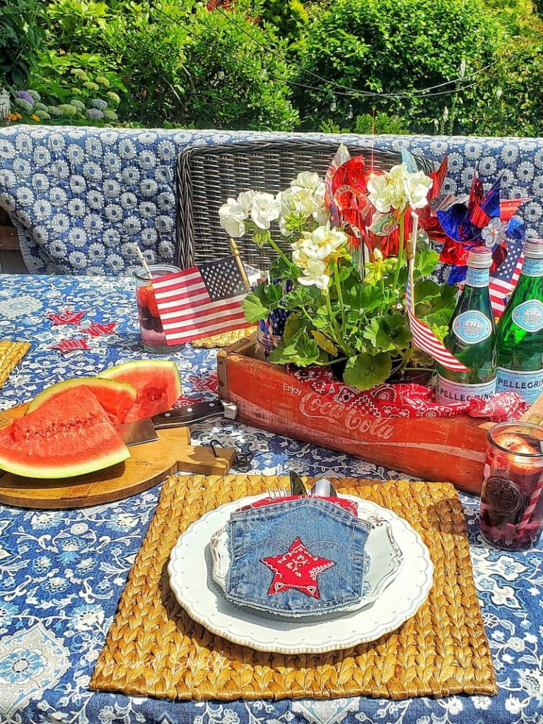 a perfectly patriotic tablescape decorated with watermelon and patriotic decor