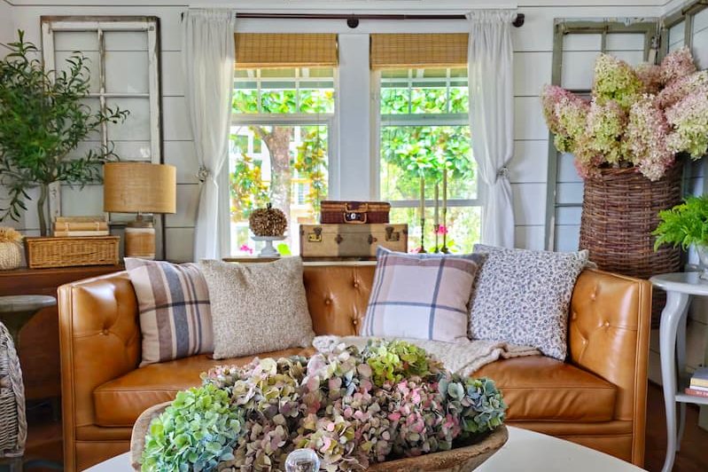 dried hydrangeas on coffee table and living room decorated for fall