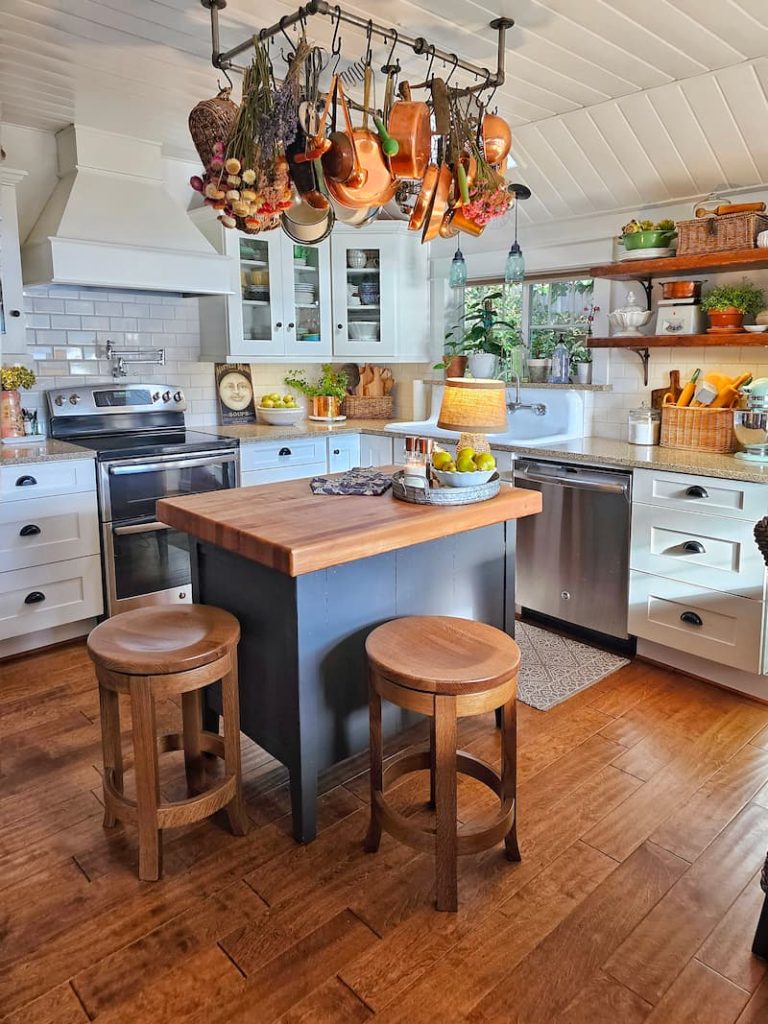 cottage kitchen with gray kitchen island and barstools