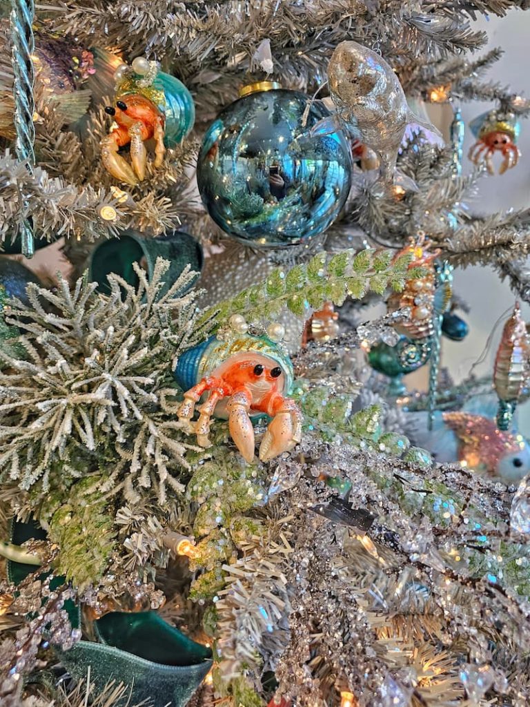 shrimp ornaments and blue balls on Xhristmas tree
