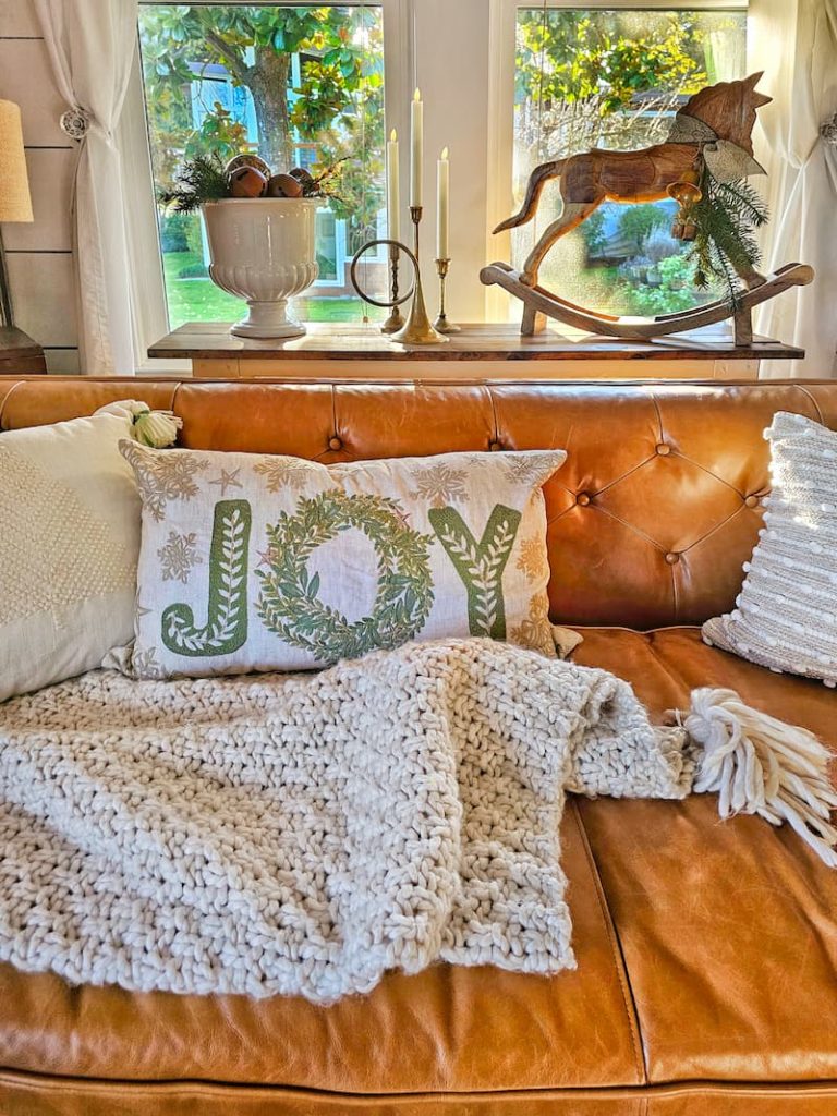 Joy decorative pillow and neutral throws