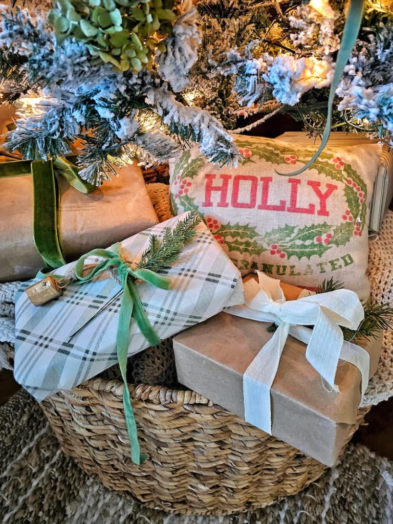 wrapped gifts in green and white under the Christmas tree