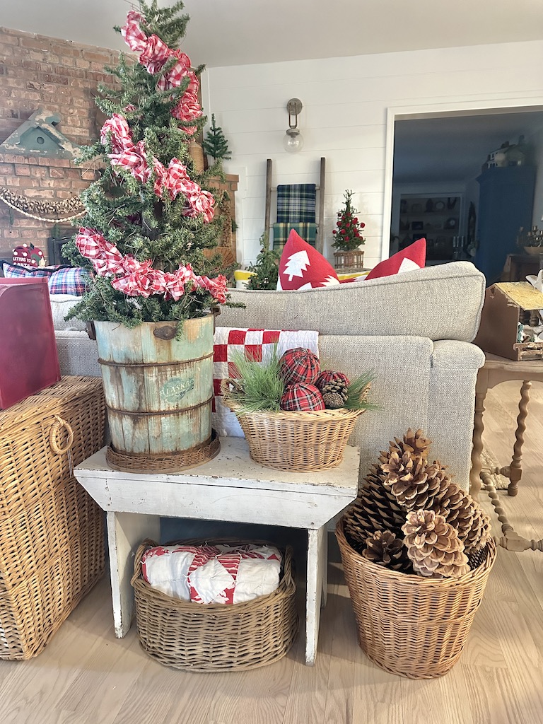 Christmas home decor ideas: red and green vintage decor with a basket of pinecones
