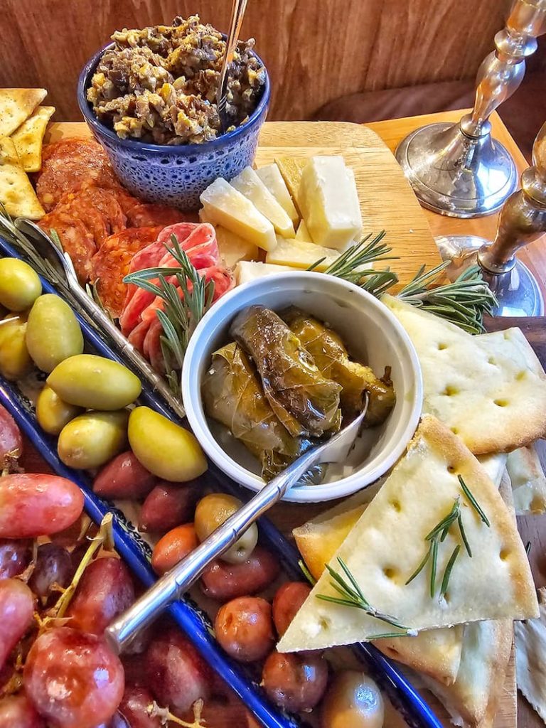 olive tapenade, dolmas, olives, grapes, parmesan